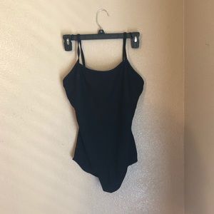 Irreversible black and plum-color dance leotard.